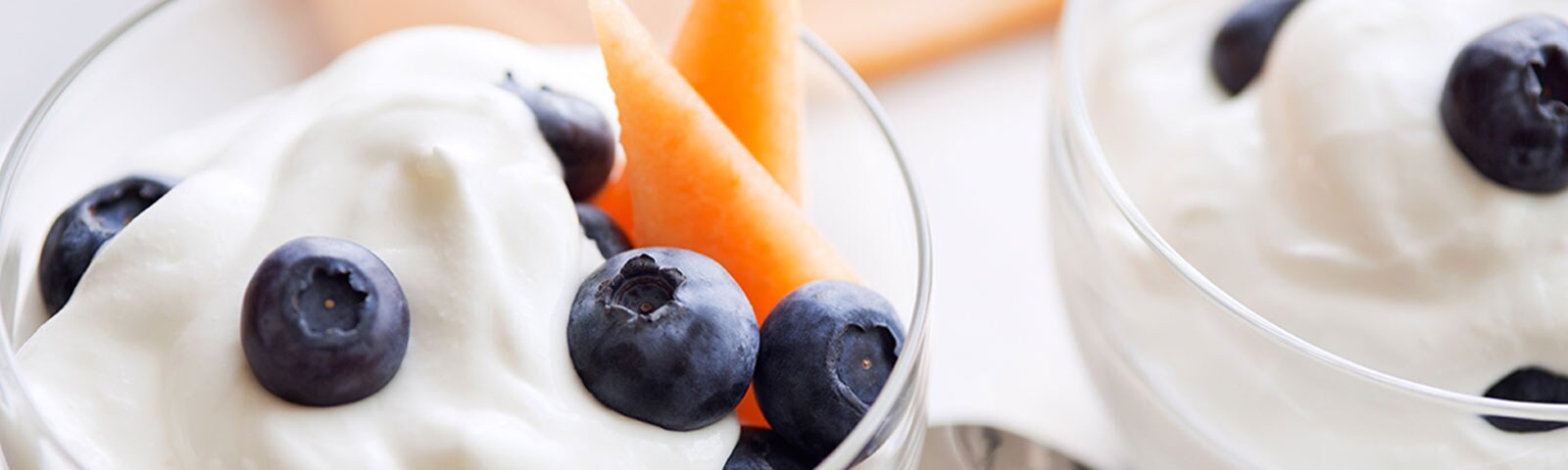 Blueberries and cantaloupe in a glass cup